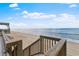 Easy beach access from the property via private wooden stairs leading to the sandy shore at 6883 S Atlantic Ave, New Smyrna Beach, FL 32169