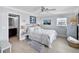 Comfortable bedroom complete with en suite bathroom and white bedding at 6883 S Atlantic Ave, New Smyrna Beach, FL 32169