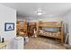 Spacious bedroom featuring multiple bunk beds and neutral decor at 6883 S Atlantic Ave, New Smyrna Beach, FL 32169