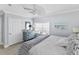 Serene bedroom boasts calming blue walls, ample natural light and white bedding at 6883 S Atlantic Ave, New Smyrna Beach, FL 32169