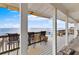 Covered deck featuring comfortable seating and breathtaking ocean views, perfect for relaxing at 6883 S Atlantic Ave, New Smyrna Beach, FL 32169