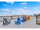 Outdoor deck area with seating, ideal for relaxing and enjoying ocean views at 6883 S Atlantic Ave, New Smyrna Beach, FL 32169