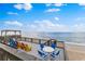 Expansive deck featuring colorful seating, and breathtaking ocean views perfect for outdoor relaxation at 6883 S Atlantic Ave, New Smyrna Beach, FL 32169