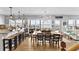 Bright dining area showcasing ocean views, a large table and open floor plan at 6883 S Atlantic Ave, New Smyrna Beach, FL 32169