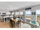 Open-concept dining and kitchen area featuring ocean views and an elegant chandelier at 6883 S Atlantic Ave, New Smyrna Beach, FL 32169