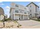 Two story beachfront home with a brick paved driveway and two car garage at 6883 S Atlantic Ave, New Smyrna Beach, FL 32169