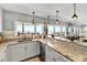Eat-in kitchen boasts granite counters, ocean views, and stainless steel appliances at 6883 S Atlantic Ave, New Smyrna Beach, FL 32169