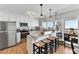 Modern eat-in kitchen with white cabinets, stainless steel appliances, and ocean views at 6883 S Atlantic Ave, New Smyrna Beach, FL 32169