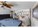 Bright living room with ocean views that features a billiards table and lots of natural light at 6883 S Atlantic Ave, New Smyrna Beach, FL 32169