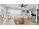 Cozy living room with light walls and comfortable seating, creating a relaxing atmosphere at 6883 S Atlantic Ave, New Smyrna Beach, FL 32169