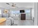 Calming main bedroom featuring ocean views, a ceiling fan, and light blue walls at 6883 S Atlantic Ave, New Smyrna Beach, FL 32169