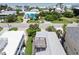 Aerial view showing a sunny neighborhood with many beautiful homes near the ocean at 6956 Turtlemound Rd, New Smyrna Beach, FL 32169