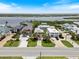 Aerial view featuring many houses with docks on the waterfront and boats on the water at 6956 Turtlemound Rd, New Smyrna Beach, FL 32169