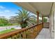 Balcony view with a lush tree and a beautiful street view at 6956 Turtlemound Rd, New Smyrna Beach, FL 32169