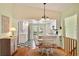 Bright eat-in kitchen with white cabinets and a black and white tile floor at 6956 Turtlemound Rd, New Smyrna Beach, FL 32169