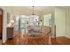 Eat-in kitchen with white cabinets and a black and white tile floor at 6956 Turtlemound Rd, New Smyrna Beach, FL 32169