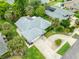 Aerial view of house showing roof, landscaping, and large driveway at 757 Hunt Club Trl, Port Orange, FL 32127