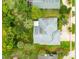 Aerial view showcasing the property's boundaries, mature trees, and landscaped backyard at 757 Hunt Club Trl, Port Orange, FL 32127