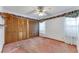 Bedroom with pink carpet, closet with wood doors, and white walls at 757 Hunt Club Trl, Port Orange, FL 32127
