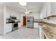 Spacious kitchen with white cabinets, stainless steel appliances, and granite countertops at 757 Hunt Club Trl, Port Orange, FL 32127