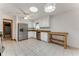 Bright kitchen with white cabinets, stainless steel appliances, and tile flooring at 757 Hunt Club Trl, Port Orange, FL 32127