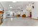 Spacious living room with tile floors, a fireplace, and a mirrored wall with a bar at 757 Hunt Club Trl, Port Orange, FL 32127
