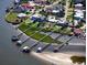 Waterfront homes with private docks along canal featuring lush landscaping and direct water access at 8 Richmond Dr, New Smyrna Beach, FL 32169