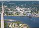 Beautiful coastal community with waterfront homes and private boat docks near a bridge and the open water at 8 Richmond Dr, New Smyrna Beach, FL 32169
