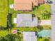 Overhead view of the house roof and lawn that highlight its proximity to neighboring homes and streets at 805 Spruce St, New Smyrna Beach, FL 32168