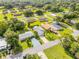 Neighborhood aerial view featuring houses with lush green lawns and mature trees at 805 Spruce St, New Smyrna Beach, FL 32168