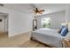 Bright bedroom featuring wood-look floors, a ceiling fan, and sunny window views at 805 Spruce St, New Smyrna Beach, FL 32168