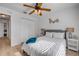 Bedroom featuring wood-look floors, a ceiling fan, and a closet at 805 Spruce St, New Smyrna Beach, FL 32168
