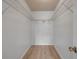 Walk-in closet with wire shelving and neutral flooring at 805 Spruce St, New Smyrna Beach, FL 32168