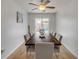 Bright dining room with stylish wood table, decor and sliding door leading to lanai at 805 Spruce St, New Smyrna Beach, FL 32168