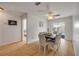 Bright dining room with stylish wood table, modern decor and sliding door leading to pool at 805 Spruce St, New Smyrna Beach, FL 32168