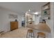 Clean kitchen with breakfast bar, providing a view into the living room at 805 Spruce St, New Smyrna Beach, FL 32168