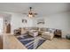 Spacious living room featuring a neutral color palette, plush seating, and a stylish area rug at 805 Spruce St, New Smyrna Beach, FL 32168