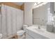 A full bathroom featuring tile floors, shower, toilet, and single sink vanity at 850 Wingate Trl, Port Orange, FL 32128