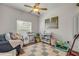 A serene Bedroom with a comfortable chair, play mat, and natural light from a window at 850 Wingate Trl, Port Orange, FL 32128