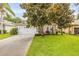 Charming single-story home with a well-maintained lawn, beautiful trees, and a two-car garage at 850 Wingate Trl, Port Orange, FL 32128