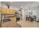 Well-lit kitchen features wooden cabinetry, tile flooring, and a stainless steel range at 850 Wingate Trl, Port Orange, FL 32128