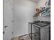 A tidy laundry room featuring modern washer and dryer and convenient shelving for storage at 850 Wingate Trl, Port Orange, FL 32128