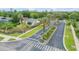 A picturesque street view featuring lush landscaping, palm trees, and well-maintained homes at 850 Wingate Trl, Port Orange, FL 32128