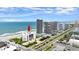 Aerial view of the building with beach access and proximity to other buildings at 901 S Atlantic Ave # 202, Ormond Beach, FL 32176