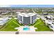 Aerial view of the building with beach access, a pool, tennis courts and gorgeous waterfront at 901 S Atlantic Ave # 202, Ormond Beach, FL 32176