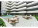 Beautiful atrium features a water feature, comfortable seating, a tree and an abundance of natural light at 901 S Atlantic Ave # 202, Ormond Beach, FL 32176
