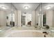 Large mirror and tub in the bathroom which offers great lighting and space at 901 S Atlantic Ave # 202, Ormond Beach, FL 32176