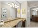 Large bathroom with granite countertops, artwork and updated cabinetry at 901 S Atlantic Ave # 202, Ormond Beach, FL 32176
