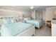 Comfortable bedroom featuring two beds with stylish decor, perfect for relaxing after a long day at 901 S Atlantic Ave # 202, Ormond Beach, FL 32176