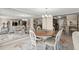 This dining area features a chandelier, seating for six, and easy access to the kitchen and Gathering room at 901 S Atlantic Ave # 202, Ormond Beach, FL 32176